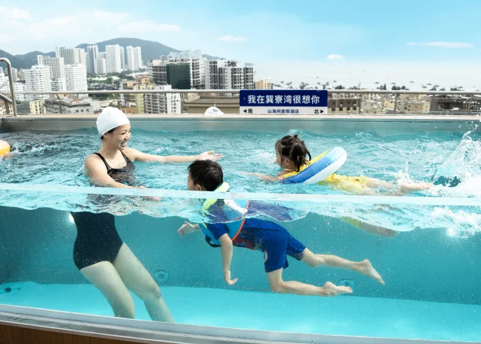 Children swimming in an Acrylic pool